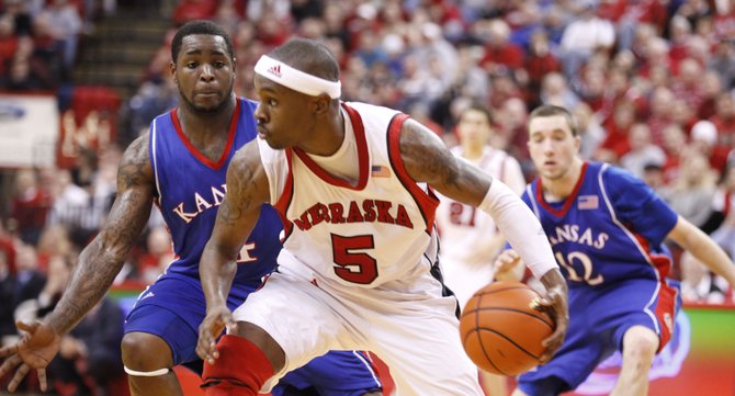 Kansas guard Sherron Collins pressures Nebraska guard Sek Henry during the second half Wednesday, Jan. 13, 2010 at the Devaney Center in Lincoln, Nebraska.